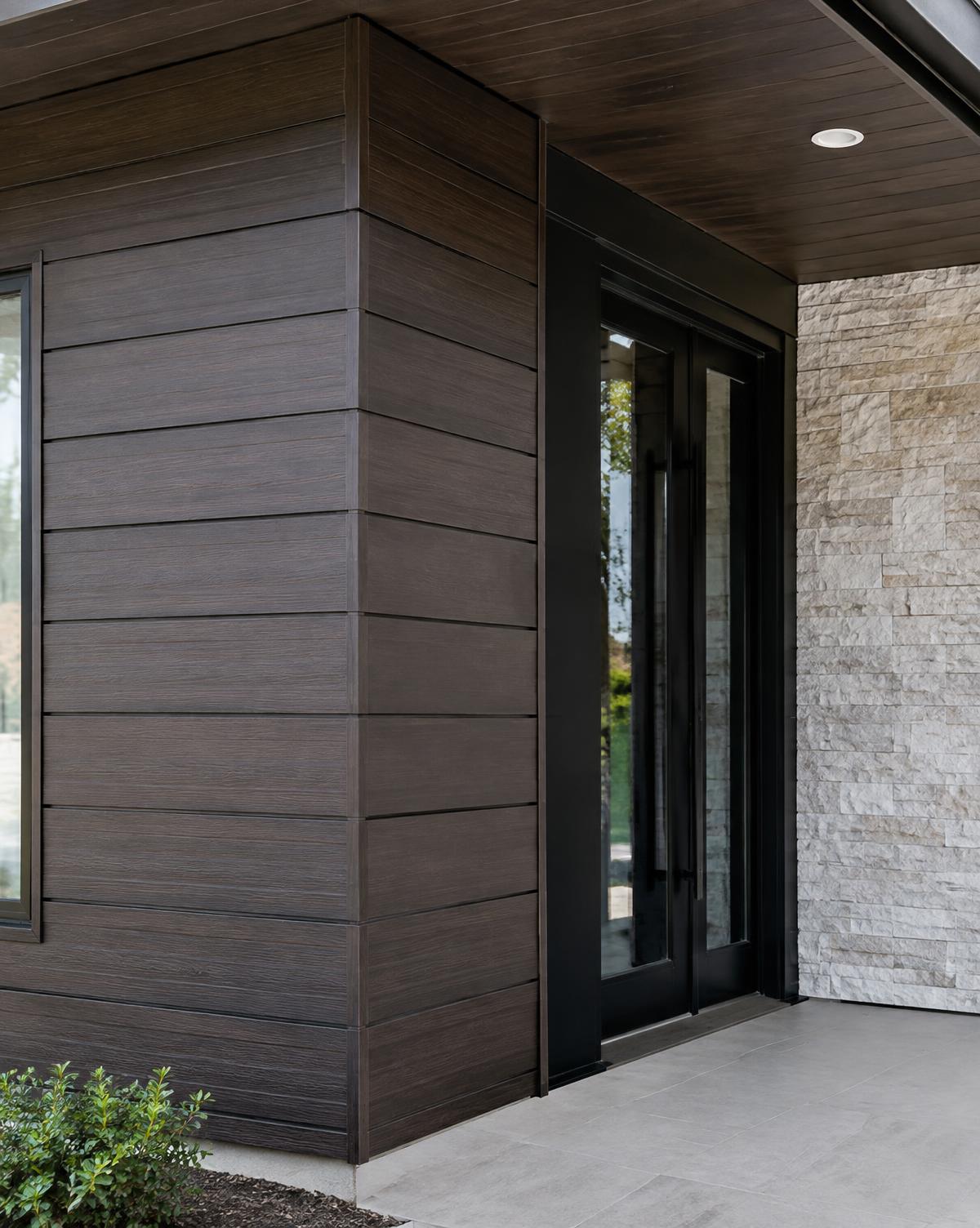Dark wood-look siding wrapping a modern entrance